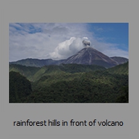 rainforest hills in front of volcano